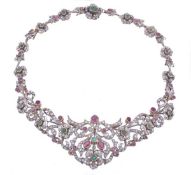 A ruby, diamond and emerald tiara/necklace by Scortecci, circa 1961, the tiara of pierced scrolled