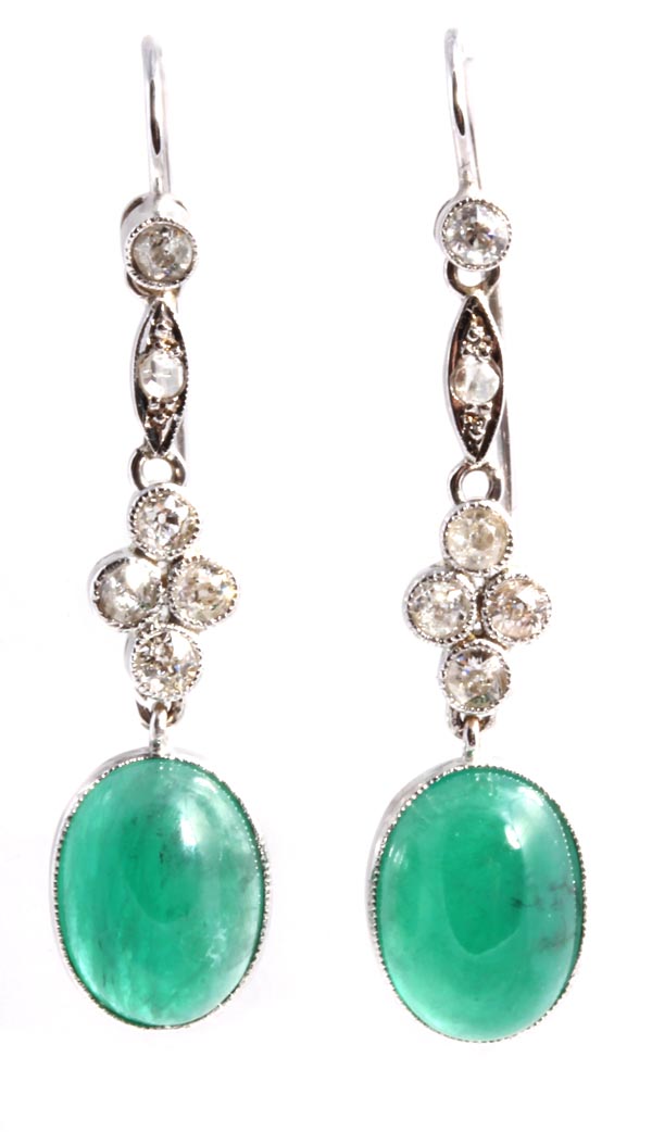 A pair of emerald and diamond earpendents, the cabochon emerald terminal suspended from articulated