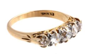 A diamond five stone ring, the ring set with five graduated old cut diamonds in a claw setting, 1.