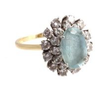 An aquamarine and diamond ring, the central oval cut aquamarine, approximately 3.05 carats, within