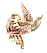 A two colour gem set bird brooch, circa 1940, the bird with eight cut diamond accented wings and a