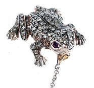 A diamond frog brooch, set throughout with eight cut diamonds, and with circular shaped rubies to