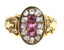 A diamond and ruby cluster ring, the three central rubies within a surround of old cut diamonds,