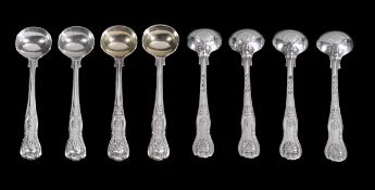 A set of eight William IV silver King`s pattern salt spoons by William Eaton, London 1834, engraved