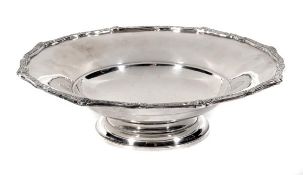 A silver circular centre dish by Adie Bros, Chester 1936, the cusped rim cast with Celtic motifs,