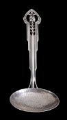 An Australian Arts and Crafts silver coloured metal ladle by James Alexander Linton, incuse stamped