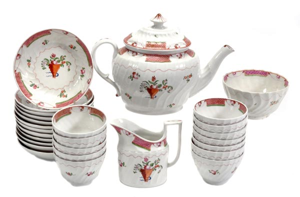 An English porcelain spirally-fluted part tea service of New Hall type, decorated win the Chinese