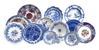 A mixed assortment of Spode blue and white printed pottery including soup dishes, shell shaped and