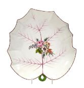 A Chelsea leaf-shaped dish, with small loop handle and painted in colours with a central floral
