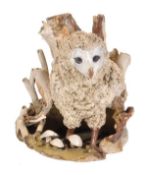 Catharni Stern (b. 1925), a stoneware model of a young barn owl, in a tree stump, signed and titled