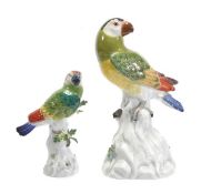 A Meissen model of a parrot, 22.5cm high, incised 59, blue crossed swords mark; and another similar