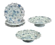 A Cantagalli part dessert service, painted in blue with putti within pierced borders, comprising;