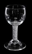 An opaque-twist mead or honey glass, the ovoid bowl supported on a double-series stem and domed