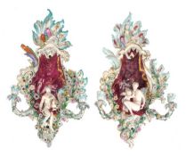 A pair of Meissen (outside decorated) flower-encusted elaborate two-branch girondoles, each