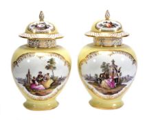 A pair of Dresden pale-yellow ground baluster vases and covers, typically decorated with