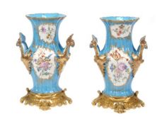 A pair of French porcelain Sevres-style turquoise-ground gilt-metal mounted two-handled vases,