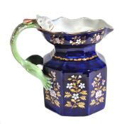 A Mason`s Ironstone dark-blue-ground octagonal Hydra jug, decorated with gilt, white and pink