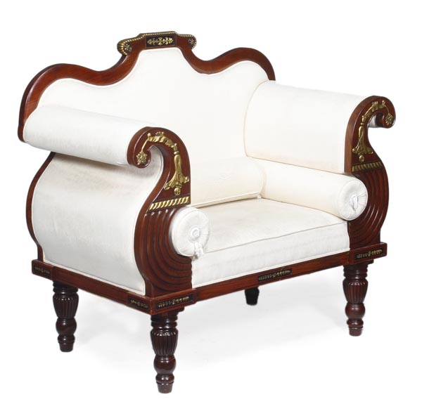 A pair of upholstered sofas in Regency style, 20th century, each parcel gilt serpentine shaped back