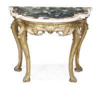 A Continental carved giltwood and marble mounted console table, mid 18th century and later, of