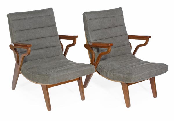 A pair of eastern European armchairs, circa 1955, with upholstered backs and seats, shaped arms and