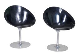 Philippe Starck for Kartell, a pair of “Eros” tub chairs, modern, with black perspex seats and