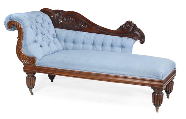 A Victorian mahogany and button upholstered chaise longue, circa 1860, foliate carved rear cresting