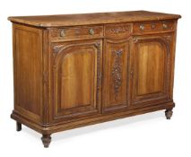 A French carved walnut buffet, in mid 18th century style, late 19th century, moulded edge above a