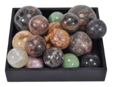 A collection of seventeen polished marble and hardstone spheres, 20th century, of varying size, the