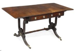 A Regency mahogany rectangular sofa table, circa 1815, two frieze drawers with false opposing
