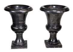 A pair of black and mottled cream marble urns, last quarter 20th century, of Campana form, 75cm