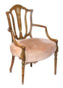 A painted beech elbow chair, in George III style, first half 19th century, shield shaped back