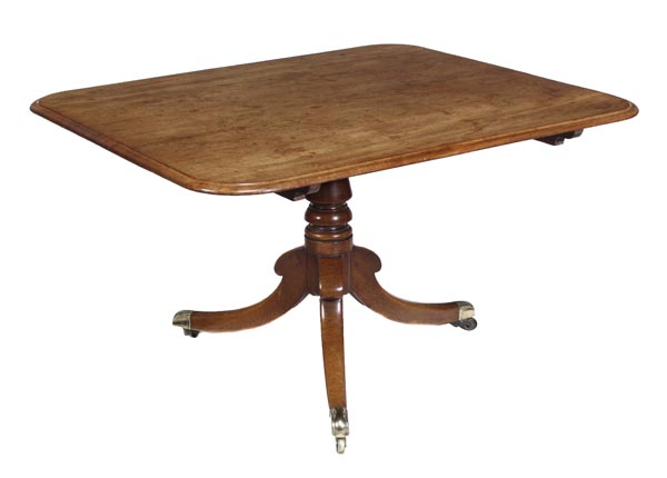 A Regency mahogany breakfast table, circa 1815, rectangular top with moulded edge, turned stem on