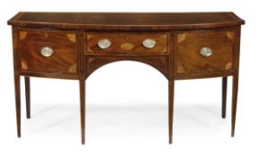 A George III mahogany, satinwood and marquetry bowfront sideboard, circa 1790, with patterae and