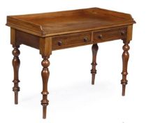 A Victorian mahogany two drawer side table, circa 1850, with three quarter gallery, two frieze