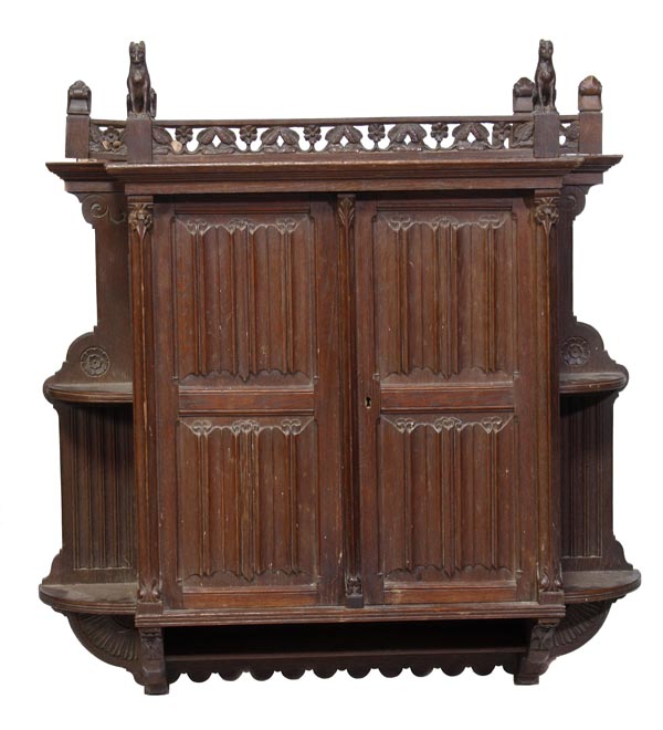A Victorian oak hanging cupboard, circa 1880, the carved and pierced gallery cornered by seated