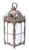 A brass hall lantern, first half 20th century, with dome top and pierced scroll mounts to frosted