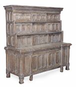 A limed oak dresser, attributed to Norman Shaw, circa 1880, moulded cornice above three shelves