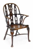 A yew, ash and beech Windsor armchair the Gothic taste, second quarter 19th century, arched back,