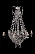 A metal and cut glass adorned six light chandelier in early 19th century taste, early 20th century,