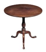 A George III mahogany circular tripod table, circa 1780, turned stem, triple downswept legs and pad