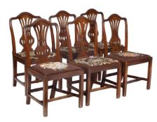 A set of six George III mahogany dining chairs, circa 1780, shaped toprail, pierced splat, drop-in