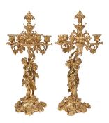 A pair of French gilt bronze five light candelabra, late 19th century, the foliate cast urn