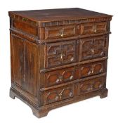 A Charles II oak chest of drawers, circa 1660, rectangular top above a dentil frieze, four long