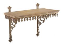 A Victorian oak and gilt metal mounted hanging wall shelf in the Gothic taste, circa 1890, 58cm