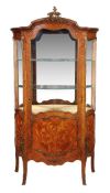 A kingwood and tulipwood veneered and gilt metal mounted serpentine fronted vitrine in the Louis XV