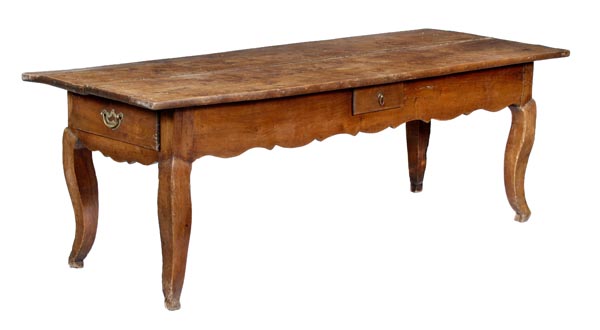 A French chestnut refectory table, first half 19th century, the twin plank top above three frieze