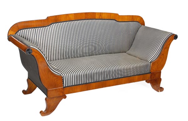 A birch and upholstered sofa, in Biedermeier style, 20th century, padded back, scrolling arms with