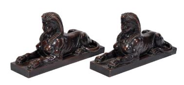 A pair of Continental patinated electrotype copper models of recumbent sphinxes, late 19th century,