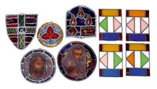 A collection of leaded and stained glass panels, 19th century, comprising two circular examples