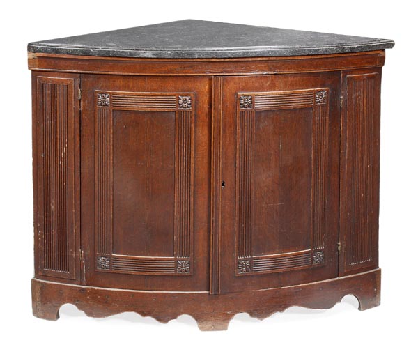 An oak and marble mounted corner cabinet, the moulded mottled grey marble top above a pair of